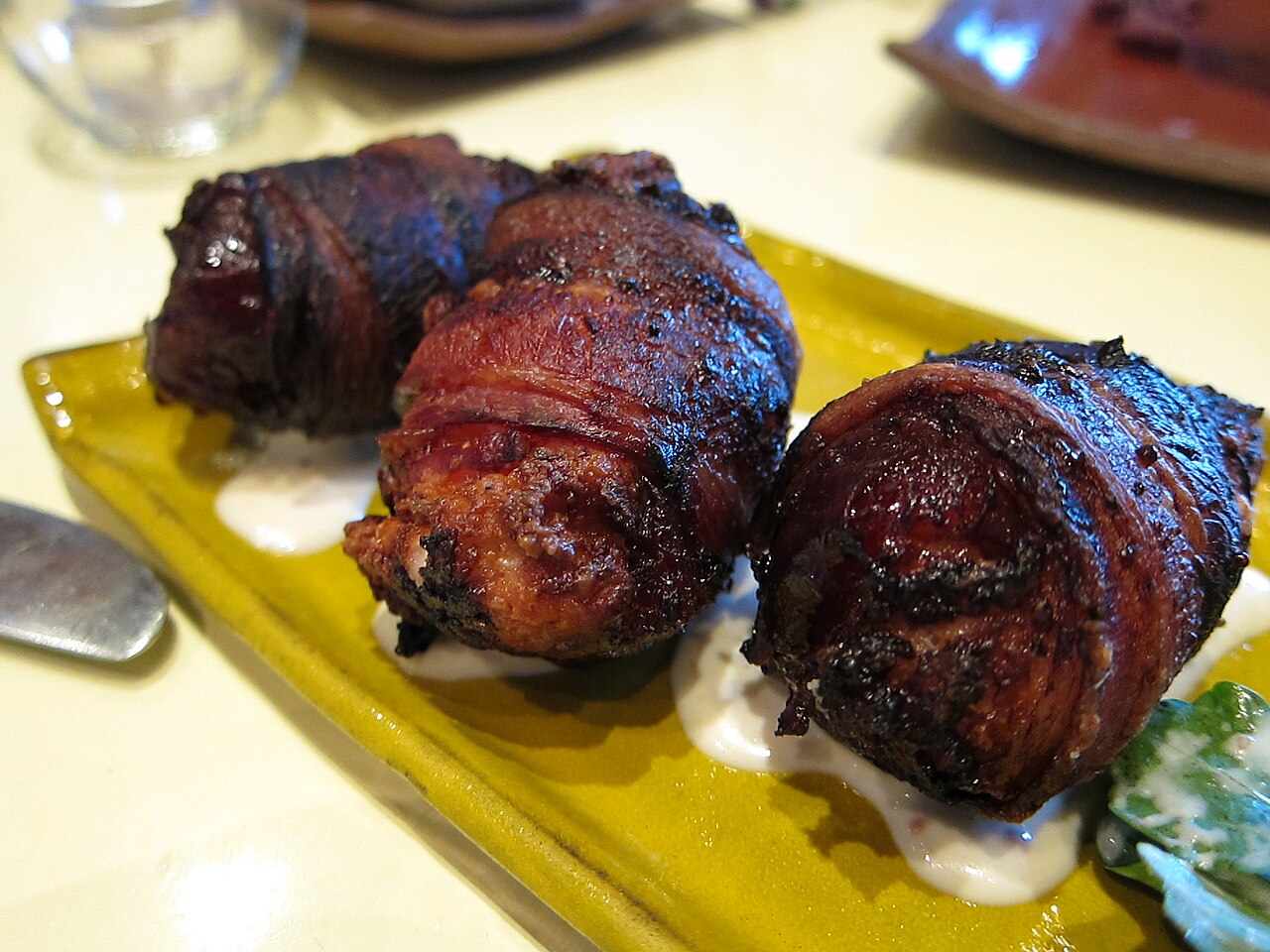 Bacon-rolled dates served as tapas, a second illustration of the appetizer