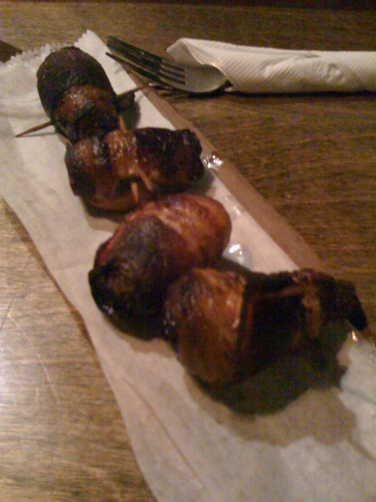 Illustrative bacon-wrapped almond dates, photo by misbehave; not our kitchen test