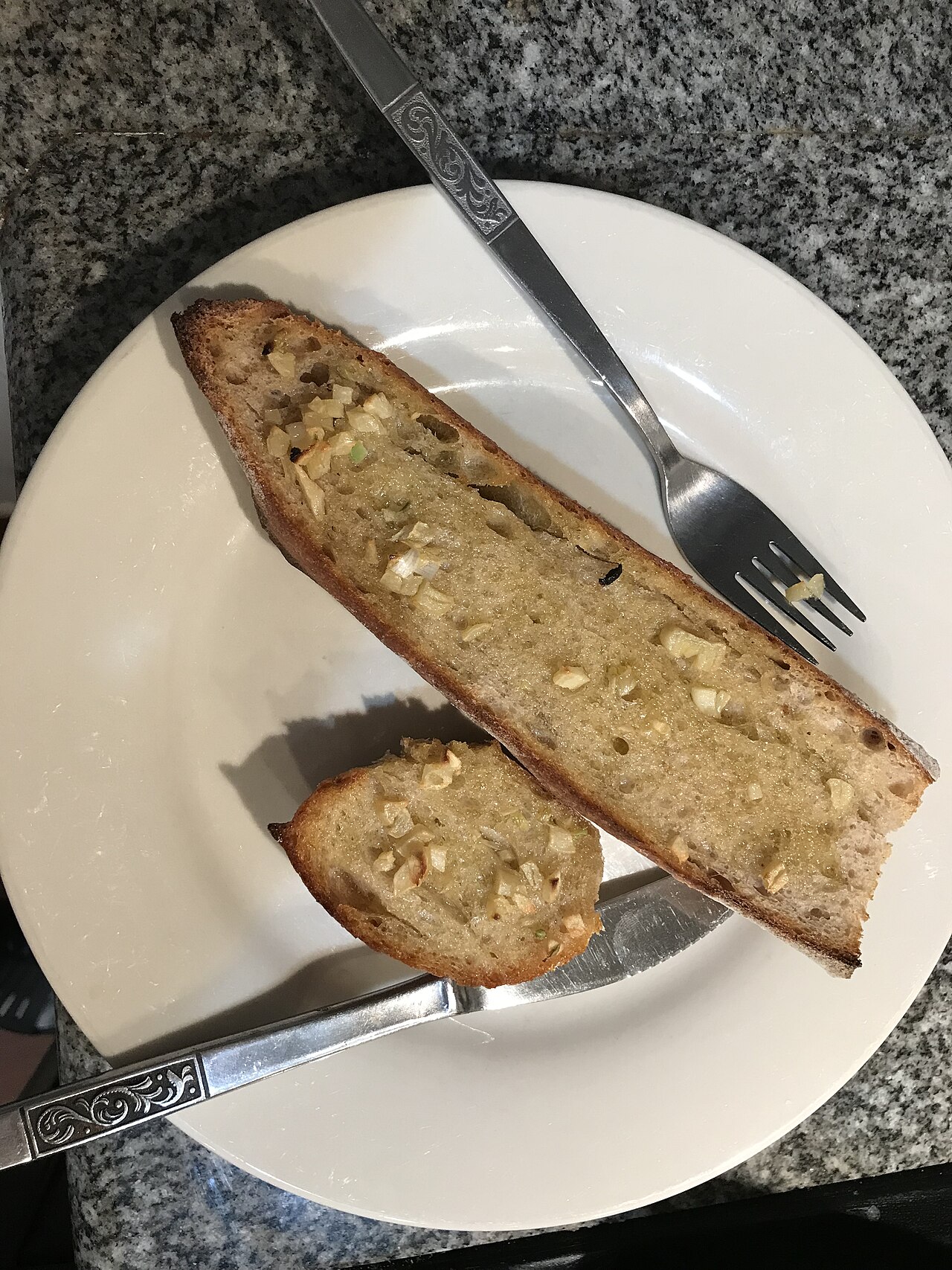 Illustrative homemade garlic bread slices, not Gino's East $6 garlic breadsticks