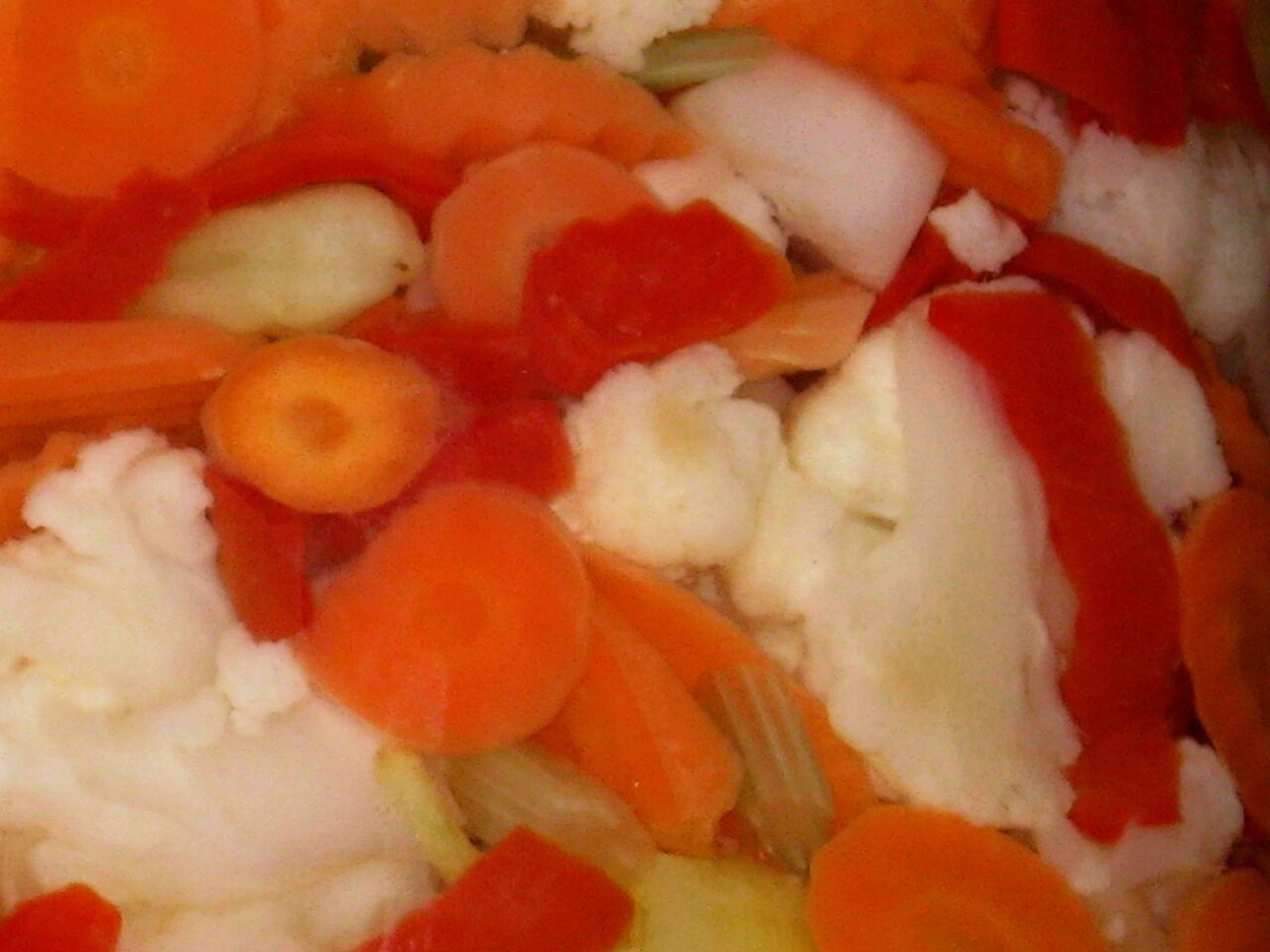 Whole pickles in a glass jar, showing a convenient ingredient for no-cook roll-ups