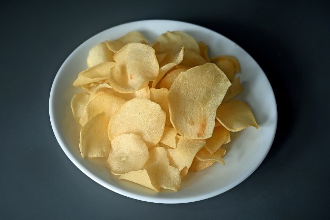 Generic bowl of potato chips, an illustration of the chips category not a photo of The Manchester's offering