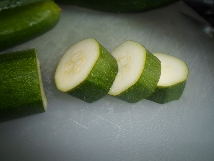 Sliced raw zucchini as an illustrative ingredient photo; cut shape differs from fries
